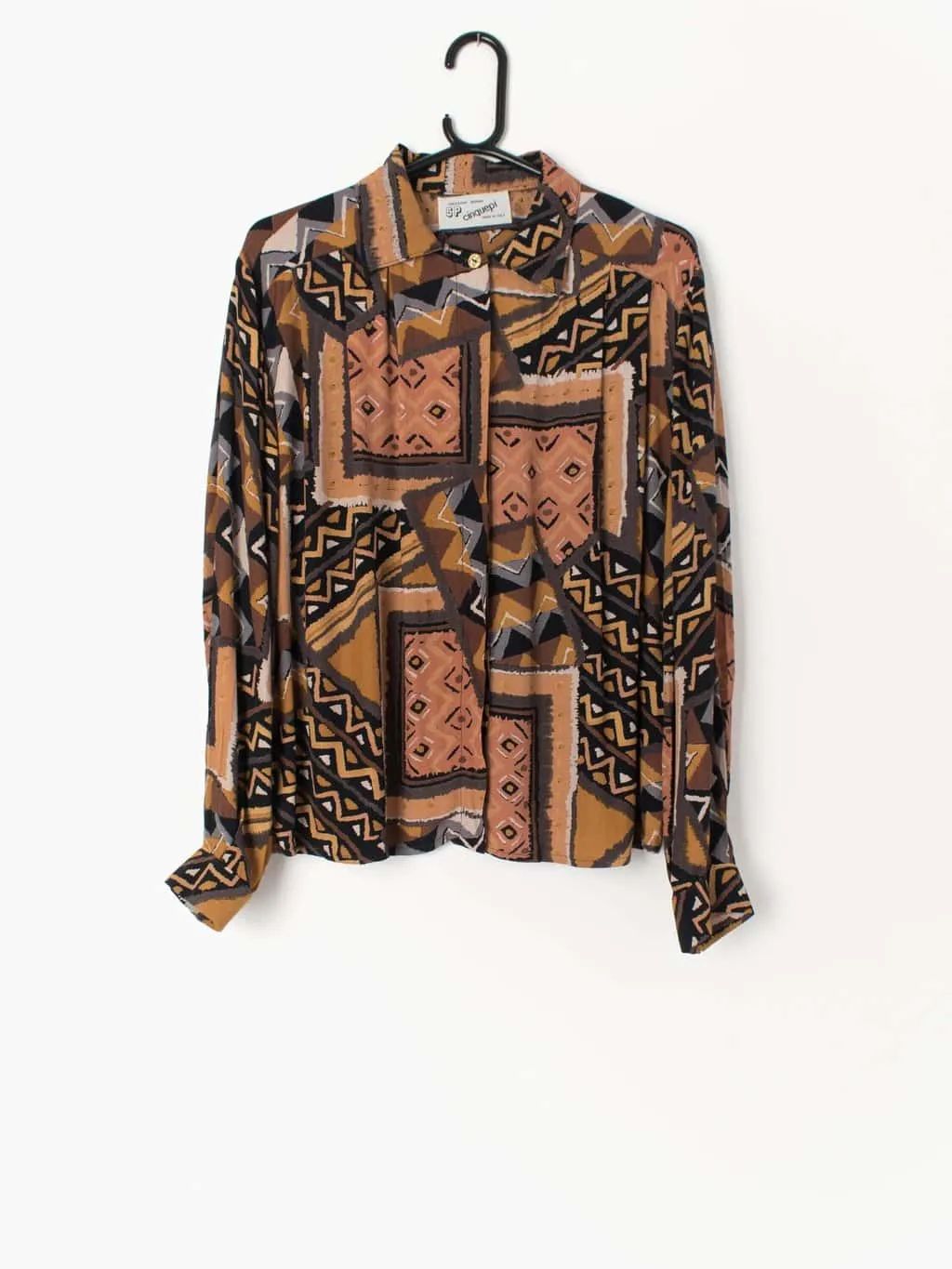 Womens vintage 90s blouse with crazy orange and black geometric aztec print. Made in Italy – Large